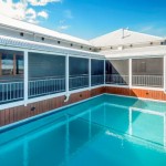 Crimsafe screens protect the verandah area, and also act as secure pool fencing